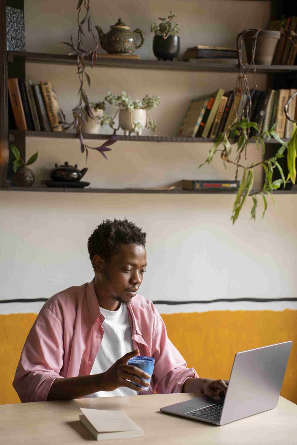 A man reading calmly with a warm drink