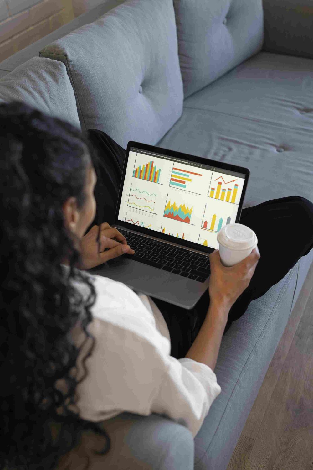 Overhead view of a woman working on a laptop